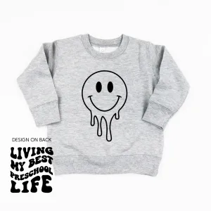 Living My Best Pre School Life (w/ Full Melty Smiley on front) - Child Sweater